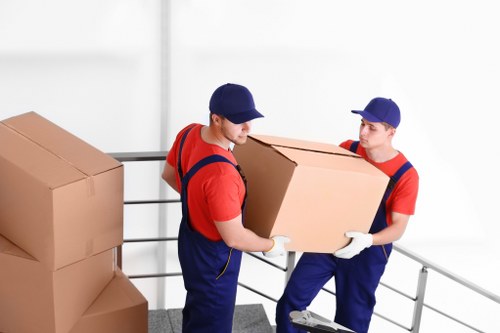 Professional office moving team handling furniture and equipment in Wimbledon