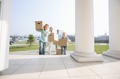 Furniture pick-up team handling bulky items in Wimbledon with care