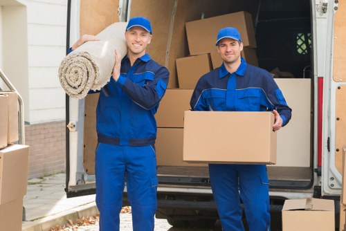 Professional house removalists in Wimbledon loading a moving van