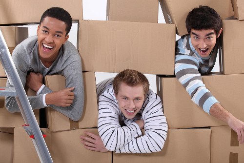 Packed moving boxes and furniture ready for local removals in Wimbledon