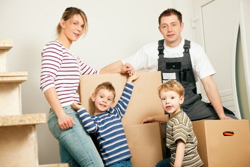 Removal crew transporting office items through Wimbledon streets