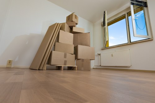 Removal van and packed boxes for a Wimbledon home move