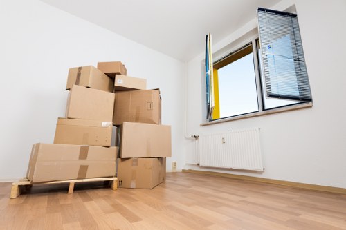Professional movers handling boxes and furniture in Wimbledon