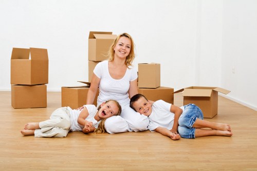 Professional movers navigating access challenges on a Wimbledon street
