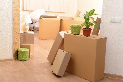 House removals truck loading items from a property in Wimbledon